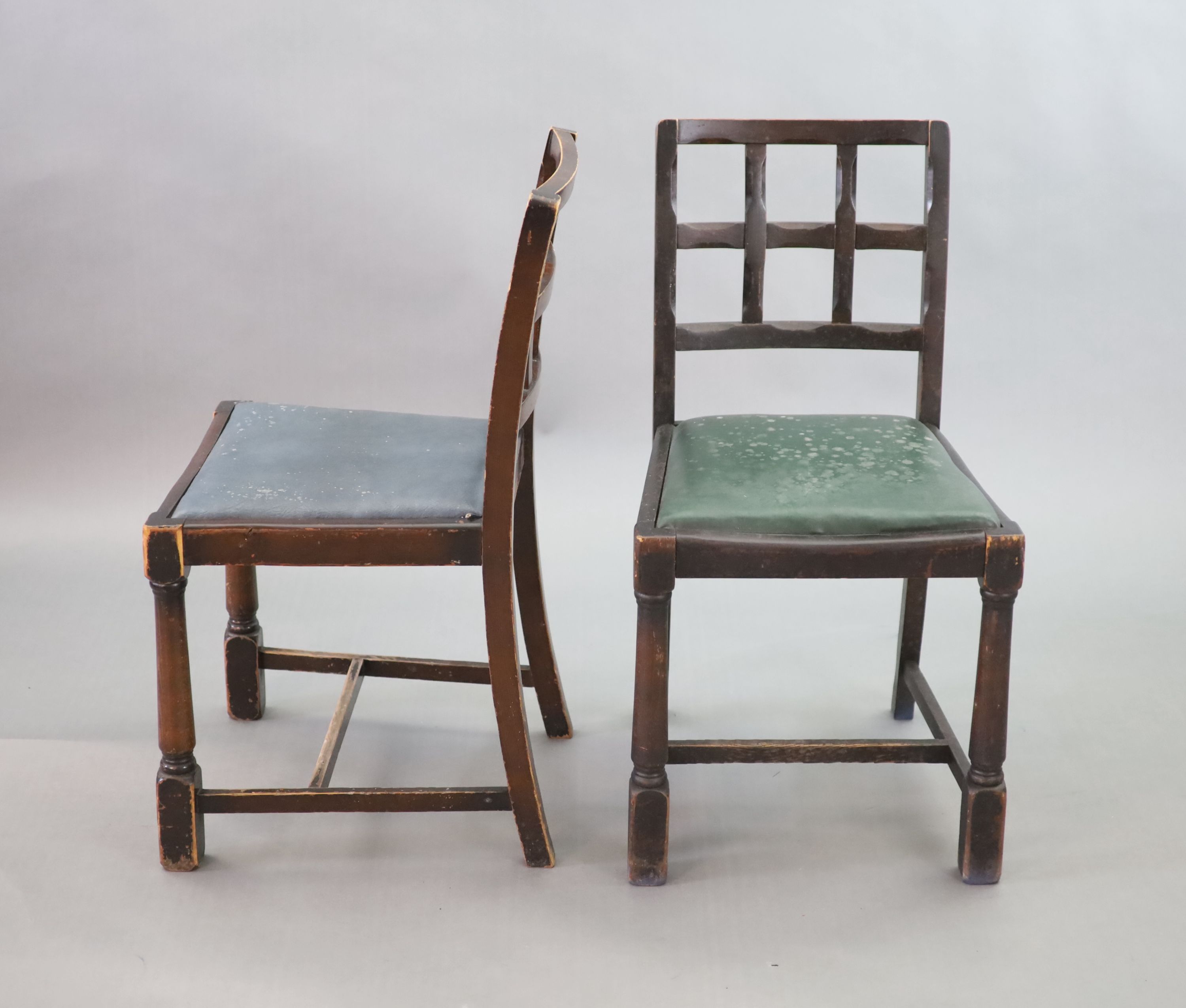 A set of twelve stained beech and oak dining chairs, with cross frame backs and drop-in seats, on turned and squared legs